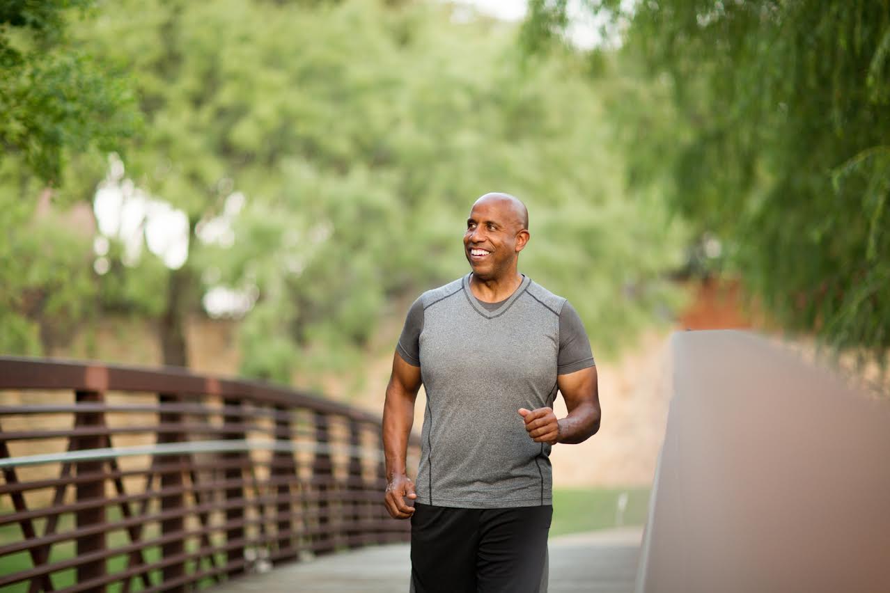 Mature African American man getting fit and exercising, thinking about the Top Five Preventative Health Measures Men Should Take.