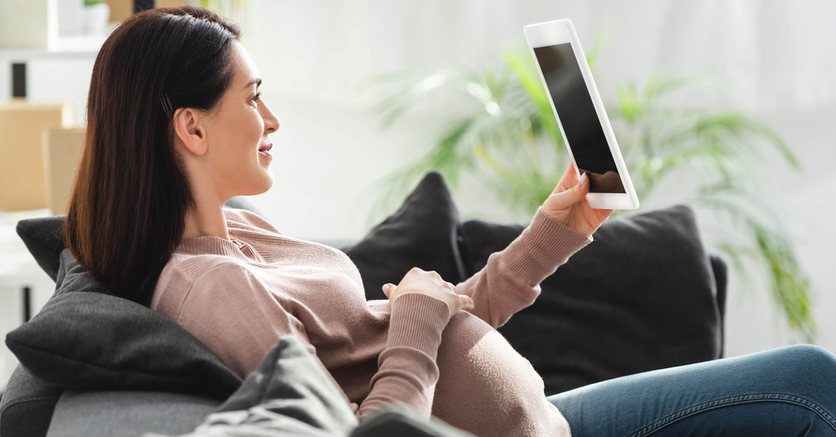 Pregnant lady on video for TeleHealth appointment.