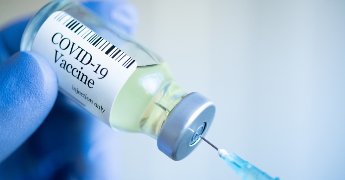 Nurse preparing COVID-19 Vaccine for injection.