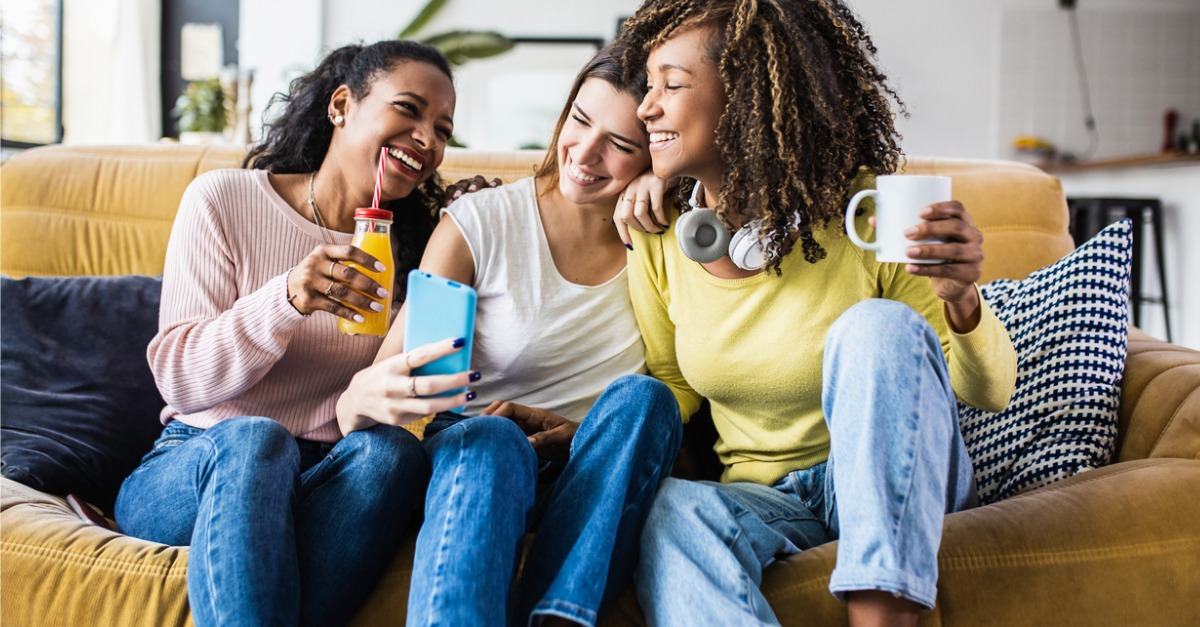 Happy Women sitting on couch