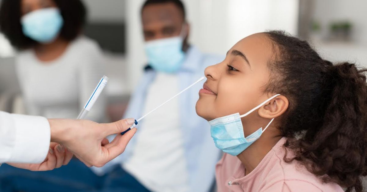 Young girl receiving COVID-19 test