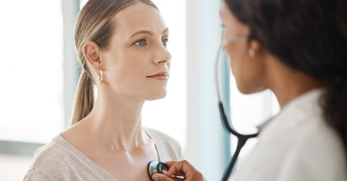 Woman getting check up at doctor