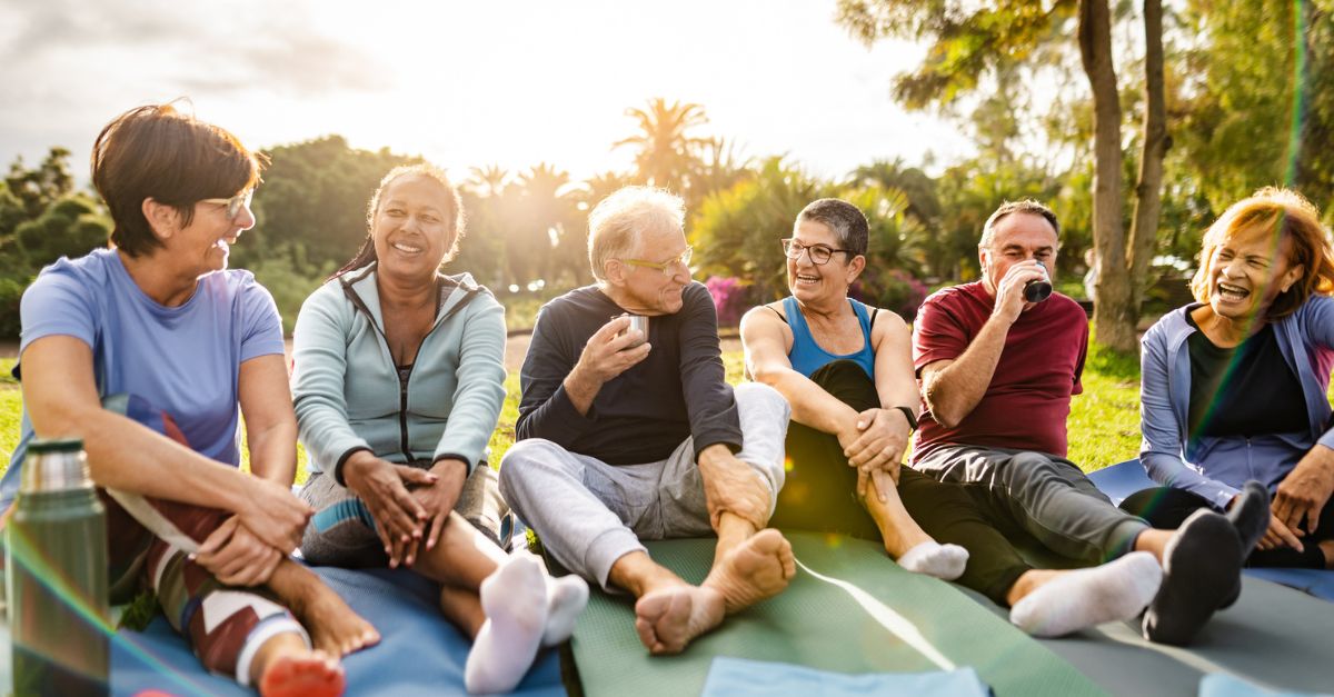 A group of happy senior friends in a park after a workout