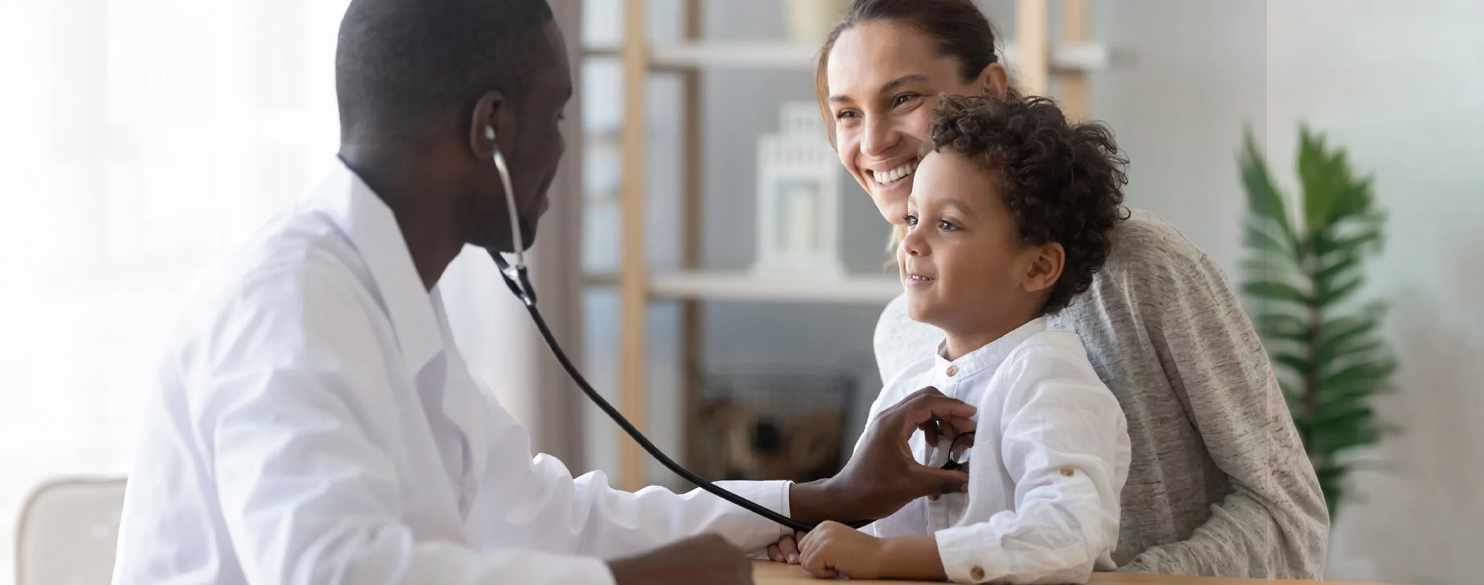 family-doctor A family doctor checking a child’s heart health with a stethoscope.